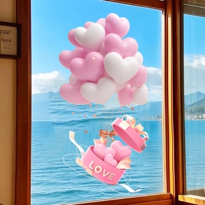 Detail of 3D pink and white heart balloon stickers with LOVE gift box on a window