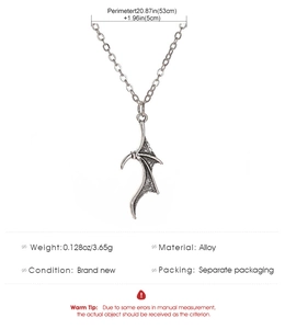 Detail showing vintage alloy dragon wing pendant with 53cm chain and size measurements