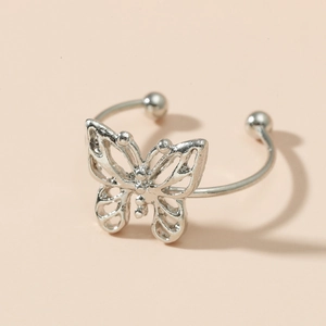 Close-up of silver hollow butterfly ring with delicate metal open design details