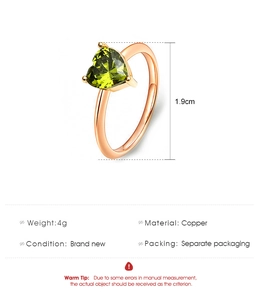 Detail view of heart-shaped green zircon ring in rose gold copper with size specs