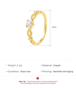 Detail of copper heart ring with infinity design and 2cm height measurement on white background