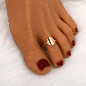 Rose gold minimalist toe ring with smooth oval surface on a plush white background