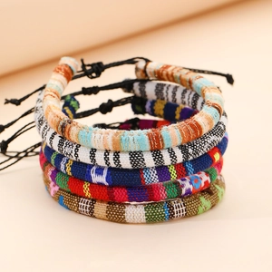 Detailed close-up of handmade bohemian woven bracelets with adjustable slip knots