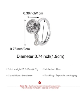 Detailed view of vintage alloy heart ring with rotating cylinder and dimensions
