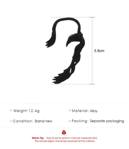 Detail view of gothic style eagle ear cuff showing 5.8cm height and 12.4g weight specs