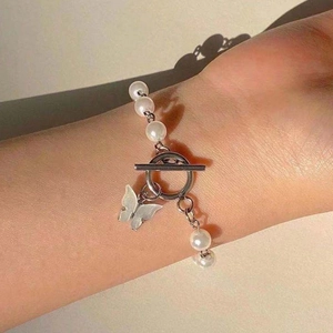 Elegant pearl bracelet with a silver OT clasp and butterfly pendant for women