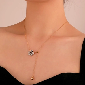 Elegant gold choker necklace with hollow black rose pendant and sparkling crystal edges