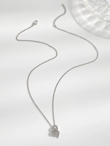 Detail of silver double heart pendant with cubic zirconia and lobster clasp