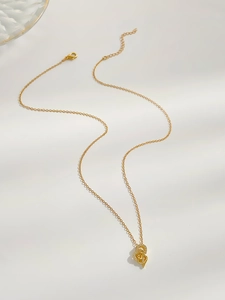 Detail view of interlocking gold heart pendant with zircon pavé and adjustable chain