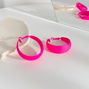 Retro fluorescent pink matte hoop earrings with wide C-shape design and bold pop style