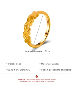 Detail of minimalist golden copper butterfly ring showing 1.7cm diameter and 2.4g weight