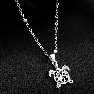 Bracelet de cheville tortue minimaliste avec motifs évidés et perles en argent