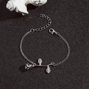 Detail of silver rose pendant bracelet with lobster clasp and adjustable link chain
