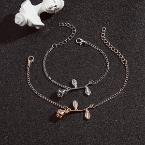 Detail of rose flower necklaces in silver and rose gold with adjustable lobster clasps