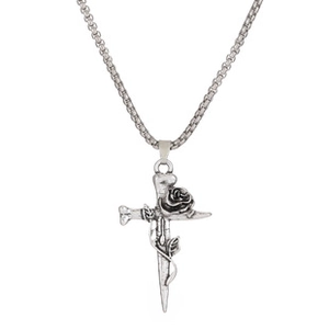 Detailed view of vintage silver cross pendant with rose motif and steel box chain