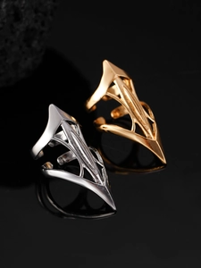 Macro view of sharp Gothic claw nail ring with hollow metal design and adjustable band