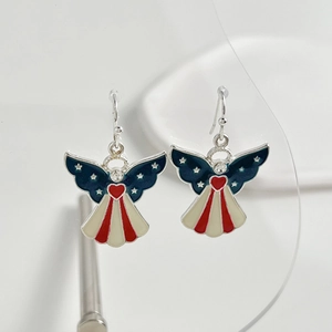 Detailed macro shot of angel wing earrings with American flag patterns and rhinestones