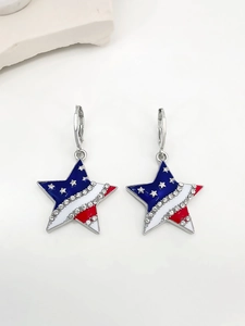 Close-up of star-shaped earrings with American flag enamel pattern and clear rhinestones