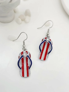 Detail of flip-flop earrings with American flag pattern and sparkling rhinestone
