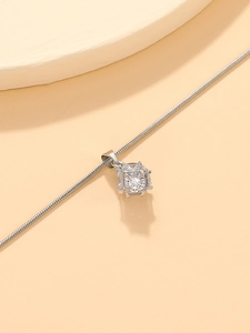 Detail of silver square pendant with a round zircon stone on a snake chain necklace