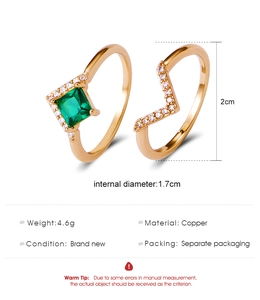Detailed view of gold plated copper ring set with green zircon and V-shaped band dimensions