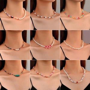 Detailed grid of nine stylish heart and pearl necklaces worn on neck for fashion display