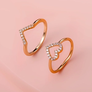 Minimalist copper heart and V-shaped ring set with brilliant zircons in rose gold finish