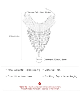 Detail view of silver sequin finger bracelet with iron chain and measurement specs