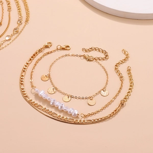 Gold layered anklet set with baroque pearls and Figaro chain for beach fashion style