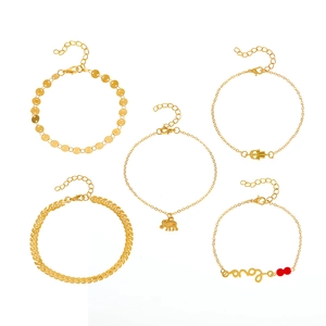 Five-piece gold anklet set with elephant, Hamsa hand, and Love charm pendants