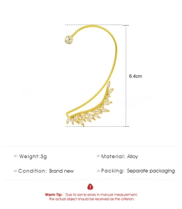 Detailed view of leaf-shaped gold ear cuff with marquise-cut cubic zirconia crystals