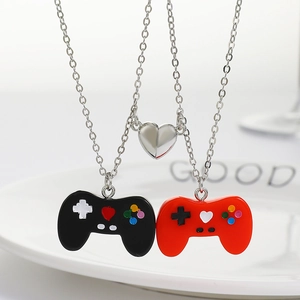 Magnetic game controller couple necklace in black and red with silver heart clasp