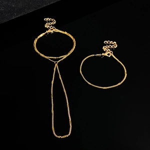 Detail of gold multi-layer sequin finger chain bracelet set with adjustable lobster clasp