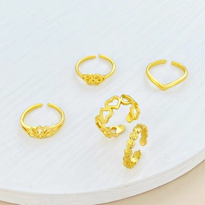 Set de 5 anillos dorados vintage con diseños de loto y corazón, ajustables para mujer