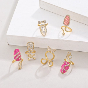 Gold-plated nail ring set with pink enamel skull, butterfly motifs and zircon stones