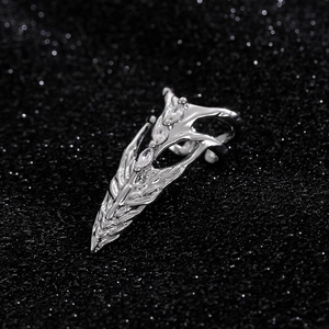 Detail of silver gothic claw ring with hollow design and three marquise zircons