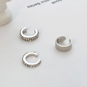Detail of three-piece C-shaped ear cuffs set with micro-paved cubic zirconia stones