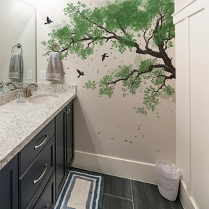 Nature wall decal featuring a large tree with green leaves and blue birds for living room
