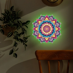 Luminous mandala wall sticker with fluorescent edges on a dark textured living room wall