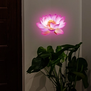 Luminous lotus wall sticker detail with glowing warm petals and soft purple backlight