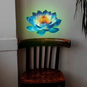 Glow-in-the-dark blue lotus wall sticker with neon effect on a white textured wall