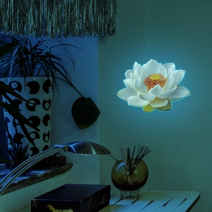 Luminous lotus wall sticker with blue glow and yellow center for home wall decor
