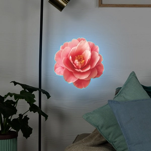 Detailed view of pink camellia floral wall lamp with soft blue luminous backlight effect