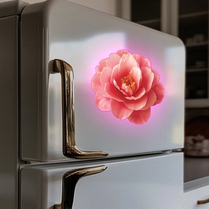 Close-up of pink camellia floral wall sticker with glowing edges on a white fridge
