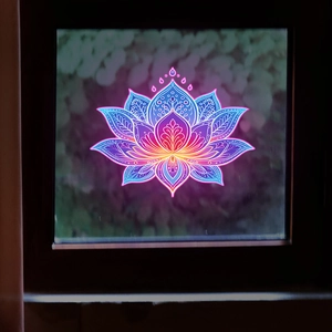 Detailed glowing lotus mandala decal with vibrant neon gradient colors on glass surface