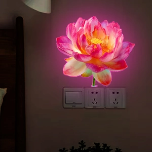 Luminous lotus flower wall sticker with pink glow effect for home interior decoration