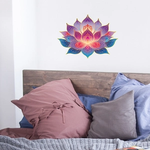 Luminous lotus mandala wall sticker decal displayed over a cozy bedroom headboard