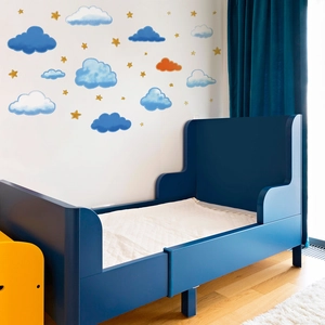 Cartoon clouds and stars wall stickers for kids room featuring blue and gold patterns