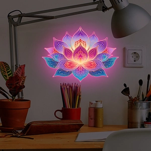 Luminous lotus wall sticker showing purple and blue mandala light patterns on a desk wall