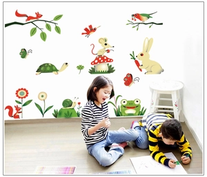 Detailed view of colorful cartoon forest animal wall stickers in a kids playroom setting